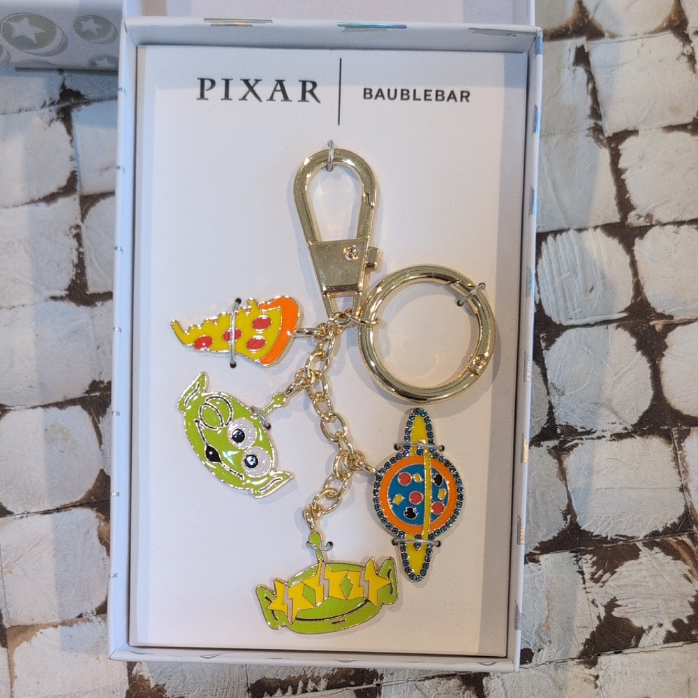 BaubleBar Gold Keychain with Colorful Toy Story Alien Charms - NIB